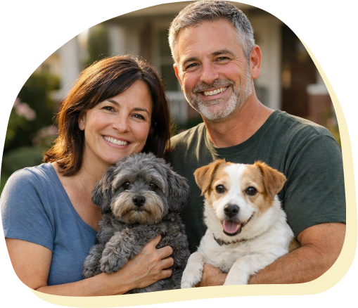 middle-age couple and puppies