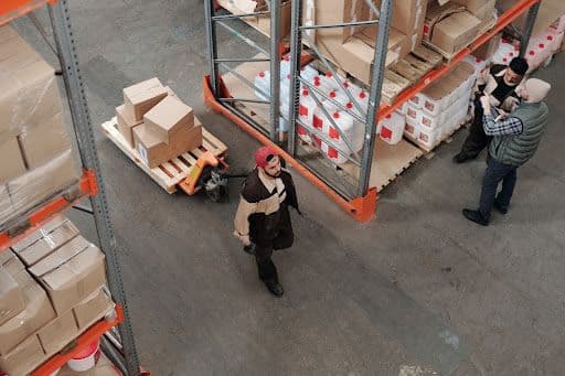 Warehouse workers engaged in material handling and inventory management.