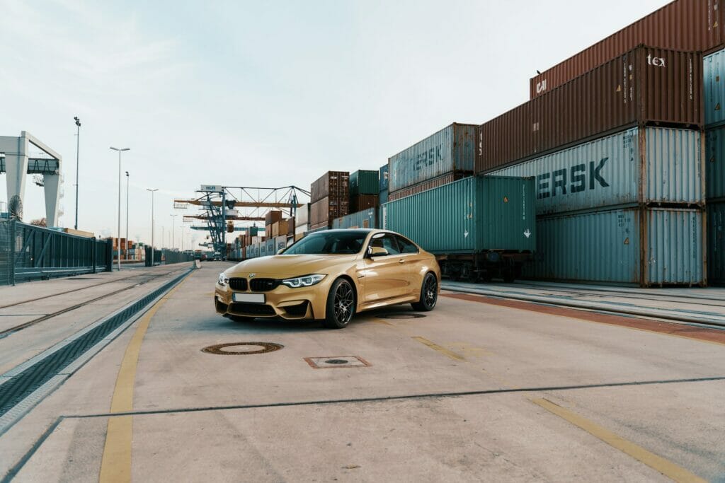 Gold, BMW M4, shipping containers.