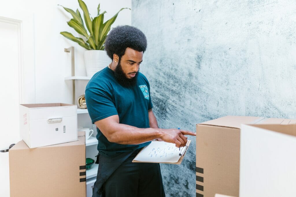 man, clipboard, room, boxes