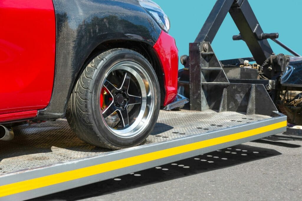 Red car, tow truck