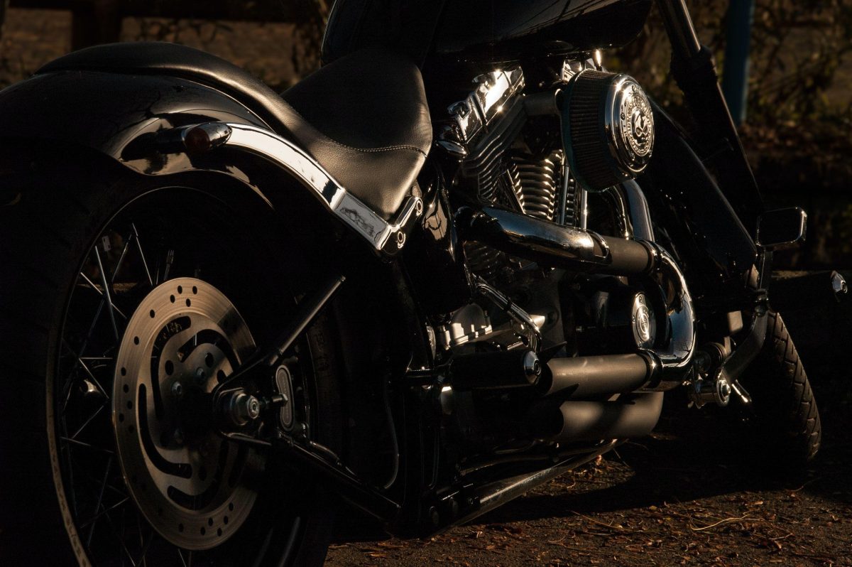 A long-distance motorcycle parked on a dirt road.