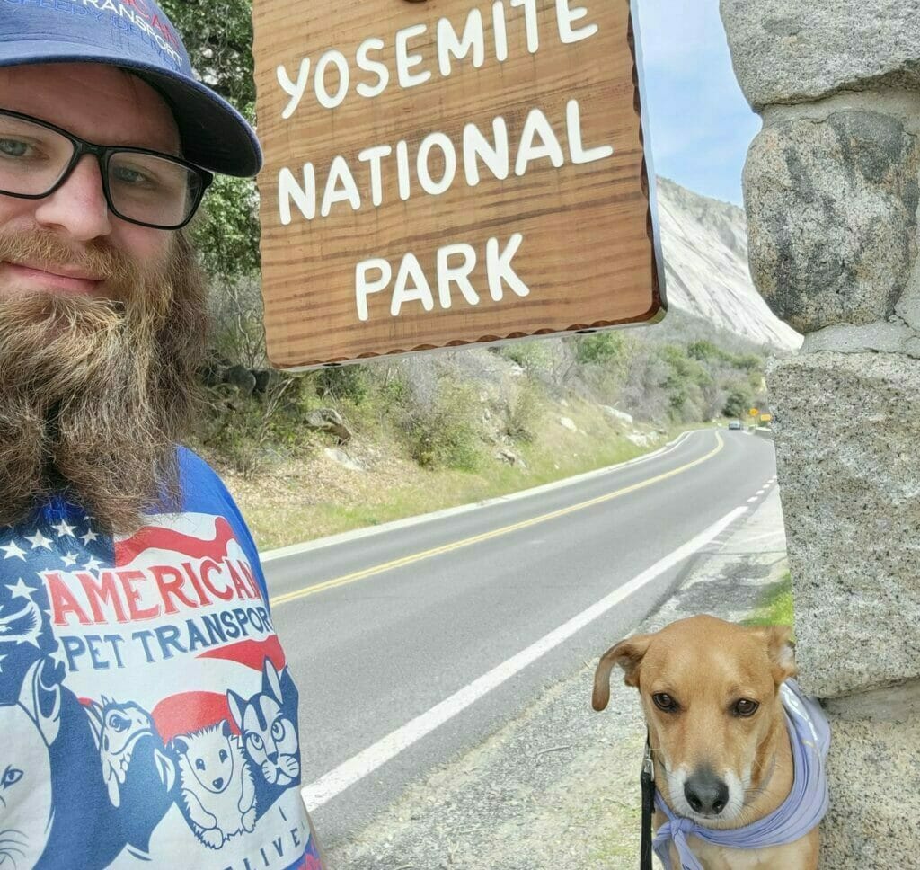 Man, dog, sign