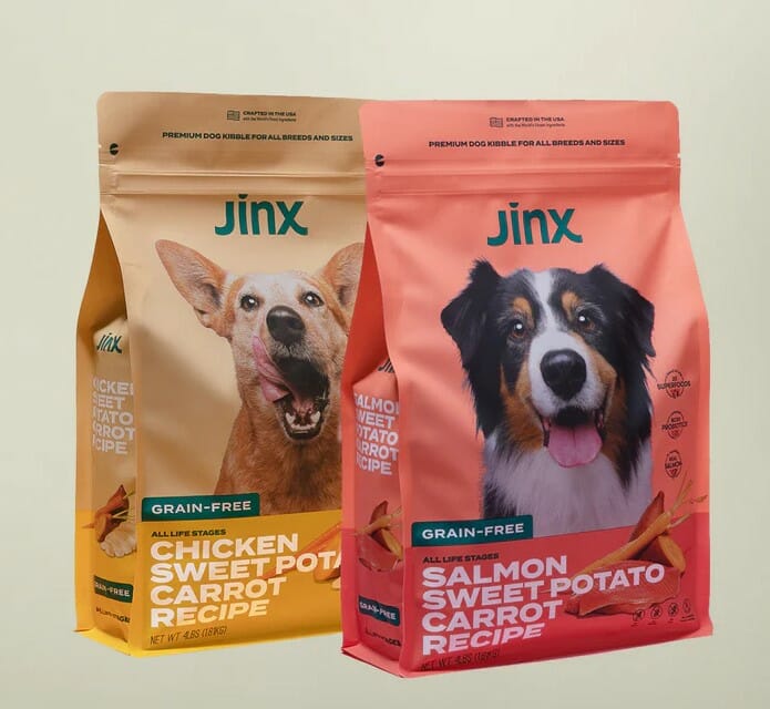 Two bags of jinx dog food. Keywords: bags, jinx, dog food.
